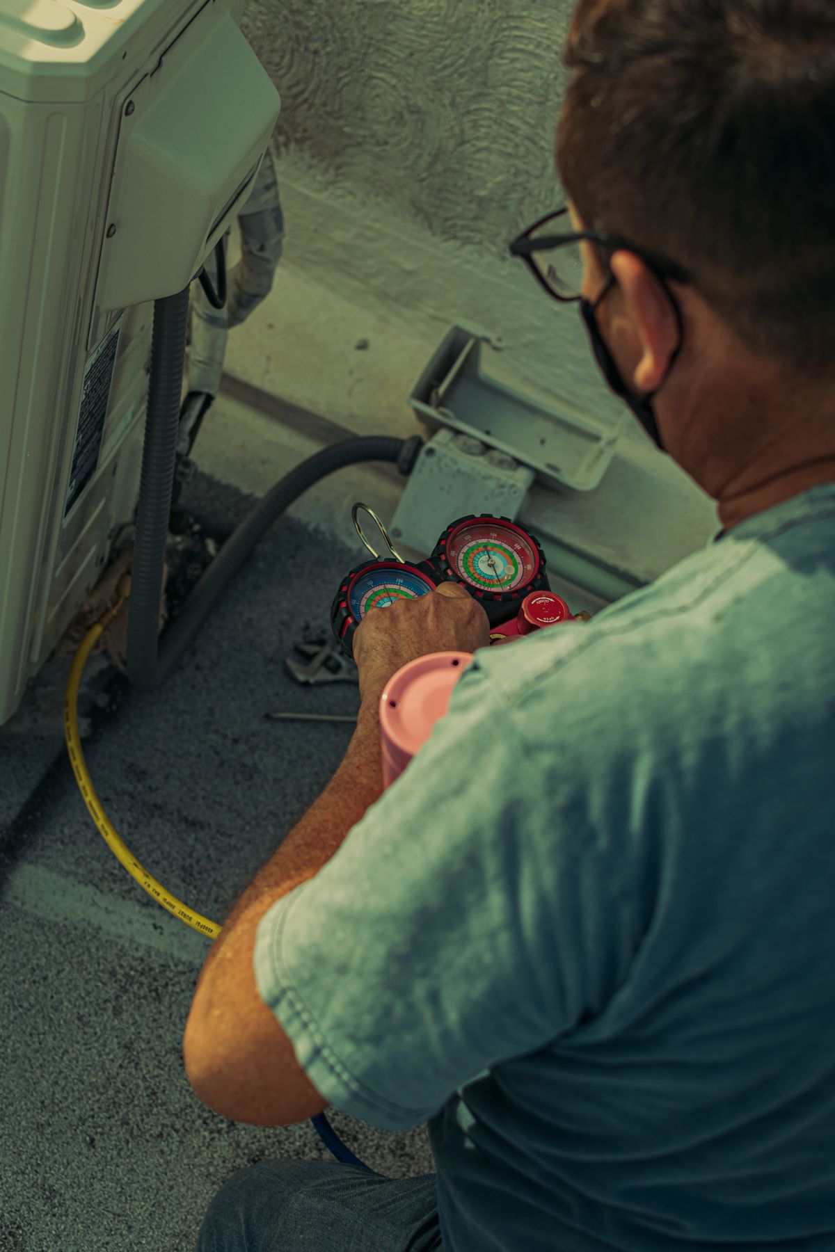 HVAC technician reading a system